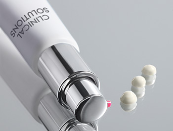 Photo of Clinical Solutions™ Retinol 0.5 on mirror with three pea-sized drops of the formula.